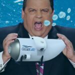 Republican Chris Christie holding a model submarine in his hands.
