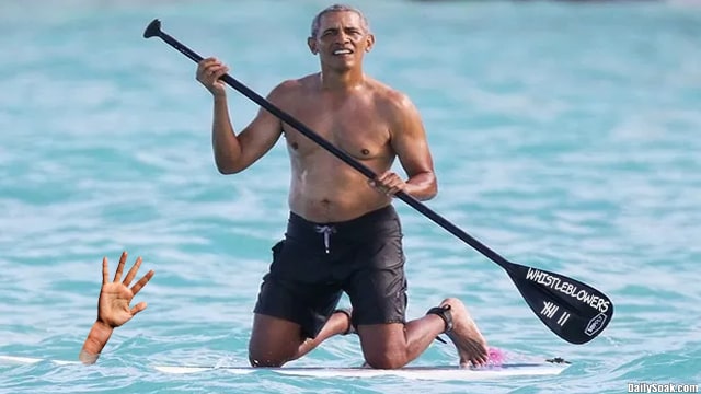 Barack Obama paddle boarding at Martha's Vineyard with Devon Archer.