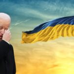 Joe Biden in Ukraine crying over a Ukraine flag.