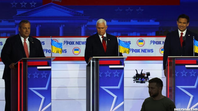 Republican presidential candidates on Fox News debate stage surrounded by Ukraine flags.