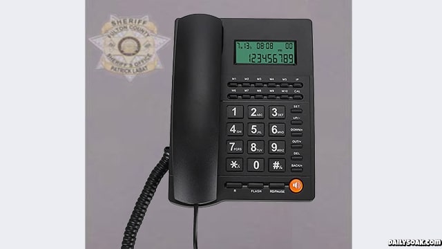 Donald Trump's Oval Office phone in parody Georgia mugshot.