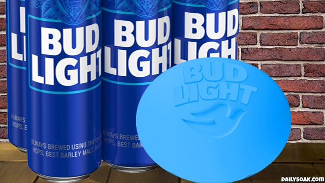 Bud light beers and a blue dove soap bar sitting on wooden table.