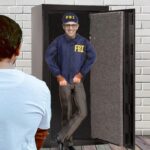 FBI agent wearing blue jacket standing next to customer's Liberty Safe.