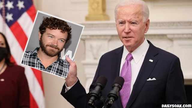 Joe Biden holding a photo of That 70s Show actor Danny Masterson.