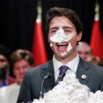 Justin Trudeau's face covered in white cocaine.