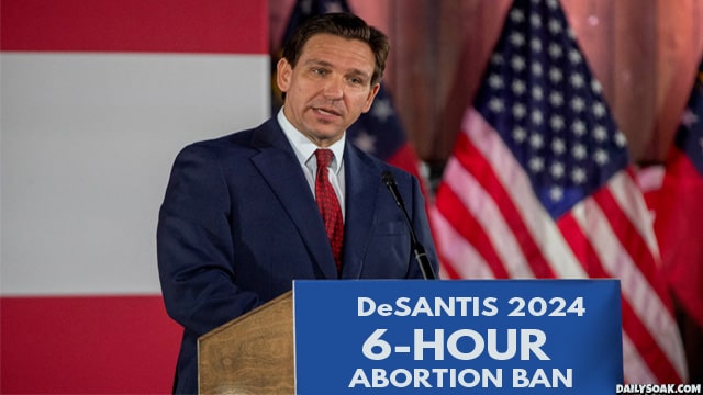 Ron DeSantis giving speech at podium on abortion ban.