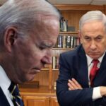 Joe Biden and Benjamin Netanyahu standing inside office in Israel.