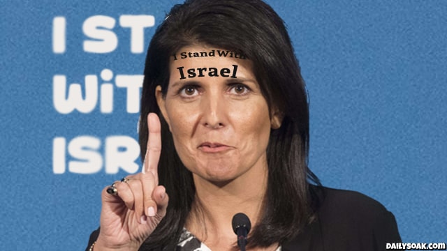 Nikki Haley with tattoo on her forehead giving speech.