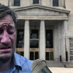 Man crying in front of Colorado Supreme Court building after Donald Trump ruling.