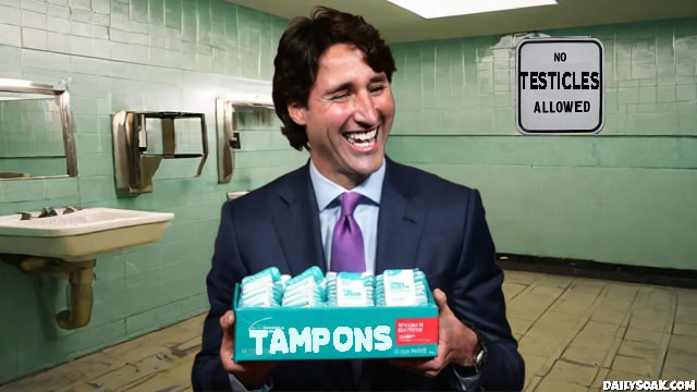Justin Trudeau holding a box of tampons inside men's bathroom.