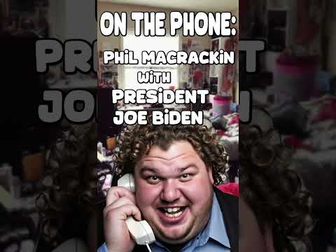 Large fat man with curly hair talking on phone.