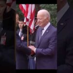 Joe Biden shaking hands with Xi Jinping.