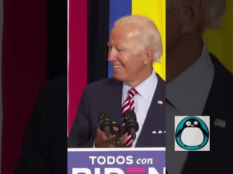 Joe Biden smiling at podium.