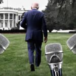 Joe Biden walking away from the press in front of White House.