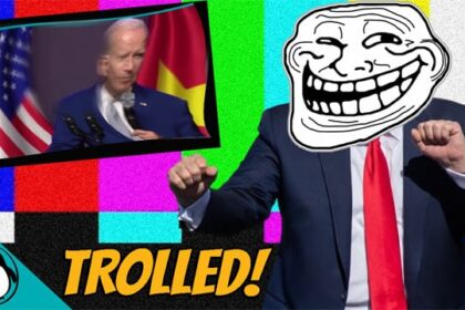Donald Trump wearing a white troll face mask in front of Joe Biden,