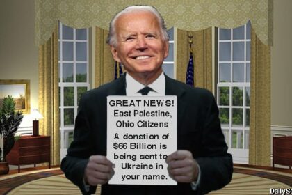 Joe Biden holding up a donation paper for East Palestine, Ohio.