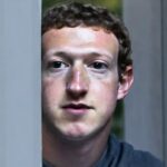 Instagram CEO Mark Zuckerberg staring through a window.
