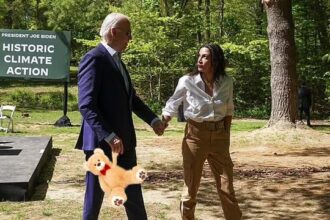 Joe Biden and AOC at a climate change Earth Day event in a Virginia park.