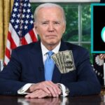 Joe Biden sitting at his desk after signing bill to ban TikTok.