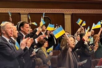US Congress members waving Ukraine flags in mock Capitol Insurrection on April 20, 2024.
