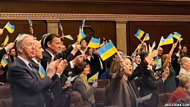US Congress members waving Ukraine flags in mock Capitol Insurrection on April 20, 2024.
