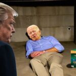 Donald Trump watching Joe Biden sleeping inside his basement.