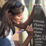 Nikki Haley writing 'Finish Them' on a bomb in Israel.