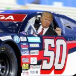 Donald Trump sitting inside racing car at NASCAR Coca Cola 600.