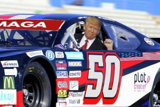Donald Trump sitting inside racing car at NASCAR Coca Cola 600.
