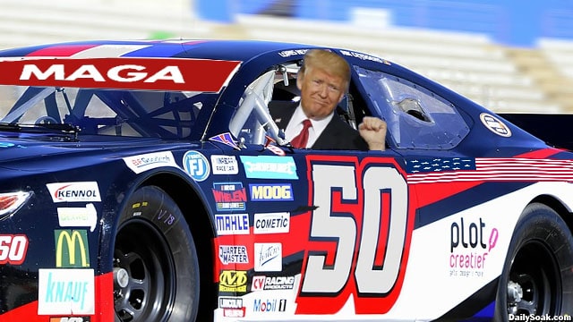 Donald Trump sitting inside racing car at NASCAR Coca Cola 600.