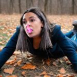 AOC on ground with chewing gum all over her face.