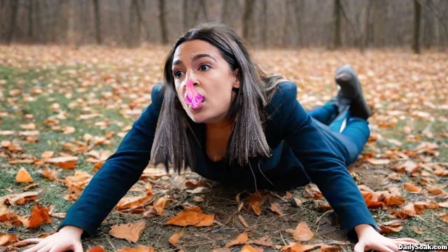 AOC on ground with chewing gum all over her face.