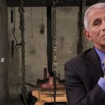 Dr. Fauci iniside of a puppy torture room.