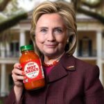 Hillary Clinton holding a jar of hot sauce for Juneteenth holiday.