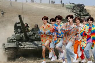 South Korean K-Pop boy band dancing in colorful outfits in front of Russian soldiers in Ukraine.