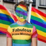 Canada Prime Minister Justin Trudeau near rainbow flags celebrating Gay Pride Month.