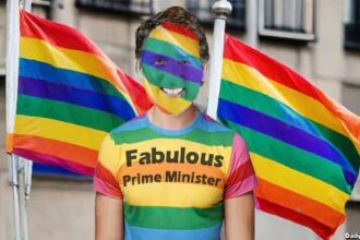 Canada Prime Minister Justin Trudeau near rainbow flags celebrating Gay Pride Month.