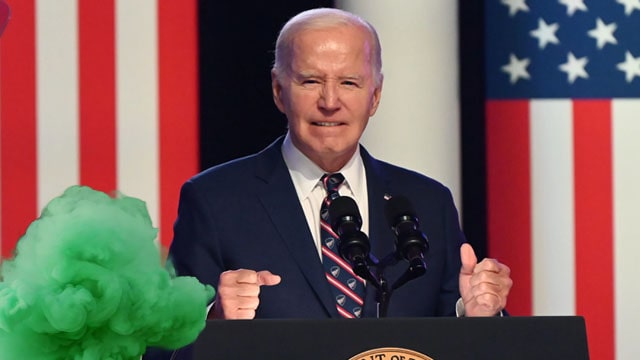 Joe Biden having a bowel movement on stage.