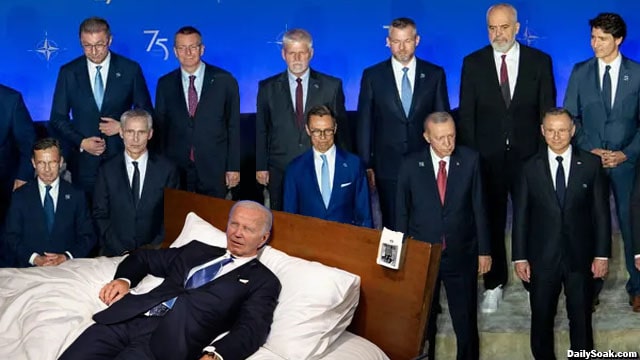 Joe Biden sleeping on a bed on stage at NATO Summit.