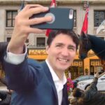 Justin Trudeau taking a selfie in front of horse trampling Canadian Mounties on Canada Day.