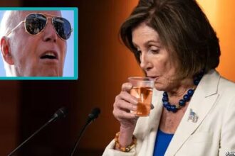 Nancy Pelosi drinking a glass of alcohol in front of Joe Biden.