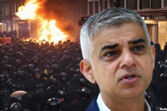 Mayor Sadiq Khan in front of mass riots and stabbings on a London street.