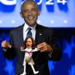 Barack Obama at the DNC holding a Kamala Harris puppet.