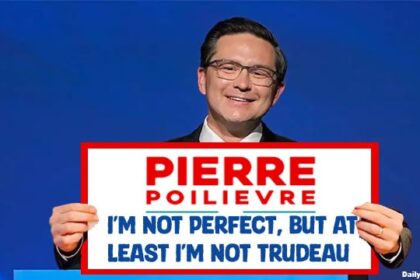 Canadian Pierre Poilievre holding up campaign sign.