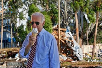 Joe Biden eating ice cream while surveying hurricane damage.