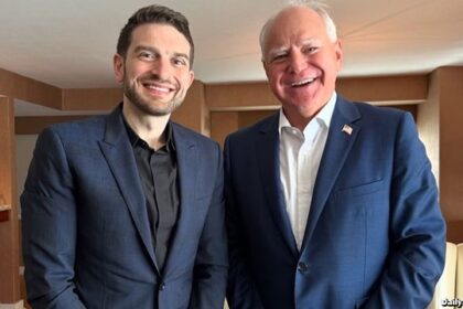 Tim Walz and Alex Soros inside of a New York City apartment.