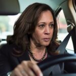 Kamala Harris inside of a car at a McDonald's drive-through window.