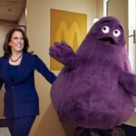 Grimace and Kamala Harris inside a McDonald's bathroom.