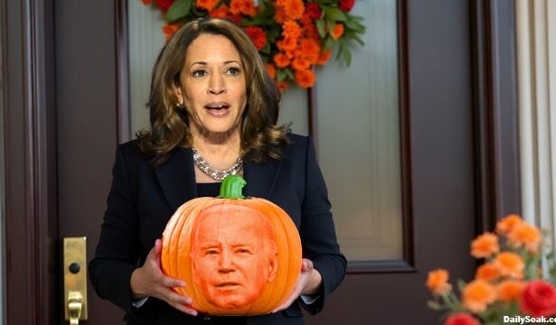 Kamala Harris holding a pumpkin on Halloween.