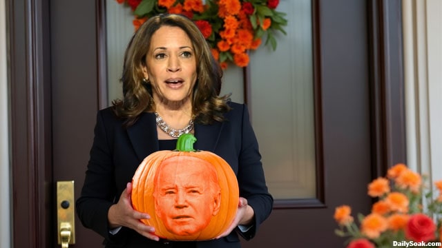 Kamala Harris holding a pumpkin on Halloween.